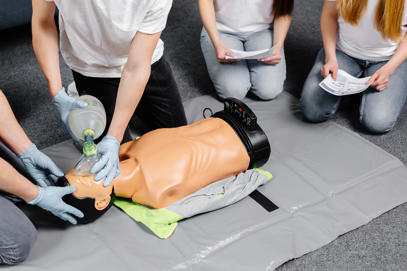 First Aid Training - Cardiopulmonary resuscitation. First aid course on cpr dummy.